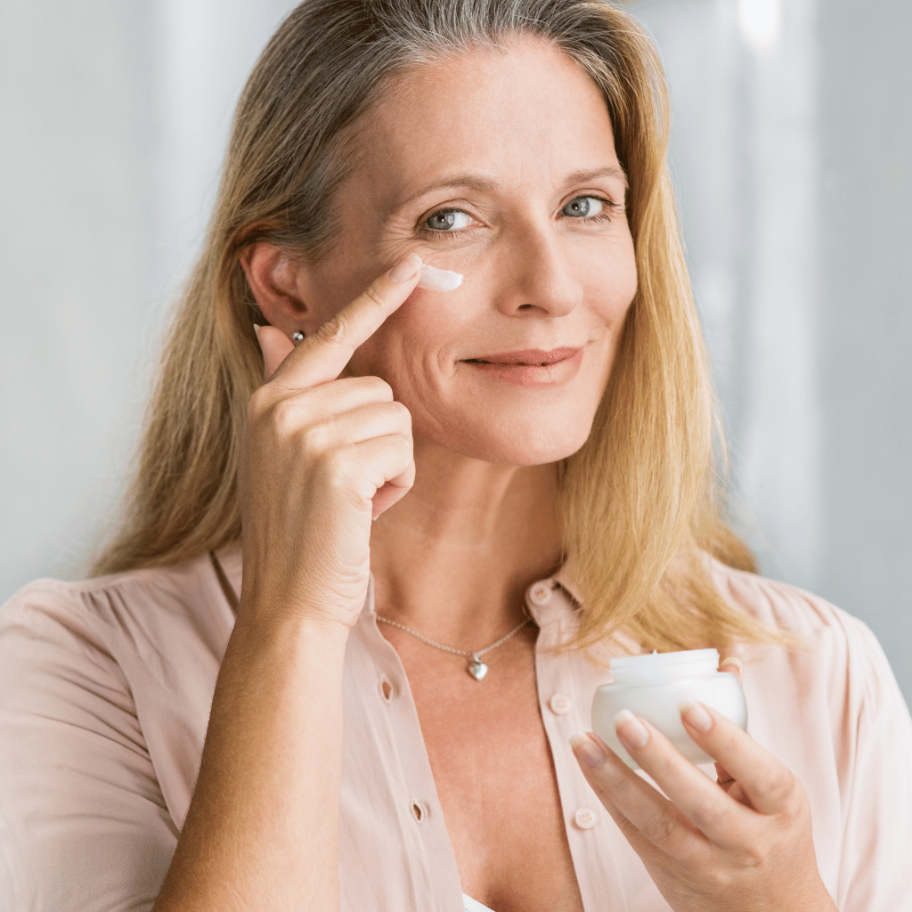 Senior woman applying anti-aging lotion from telehealth services by Holistically RX